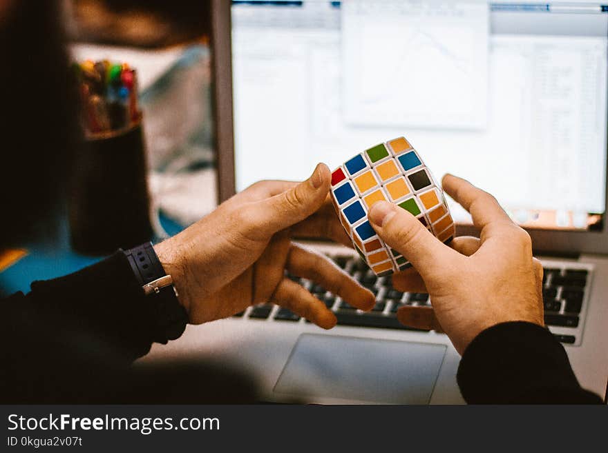 4x4 Rubik&#x27;s Cube on a Man&#x27;s Hand