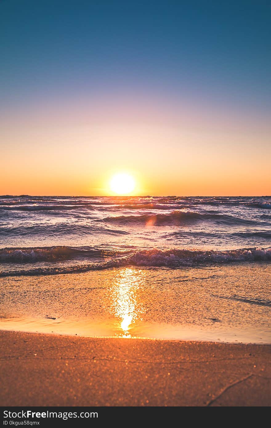 Scenic View of Ocean During Sunset