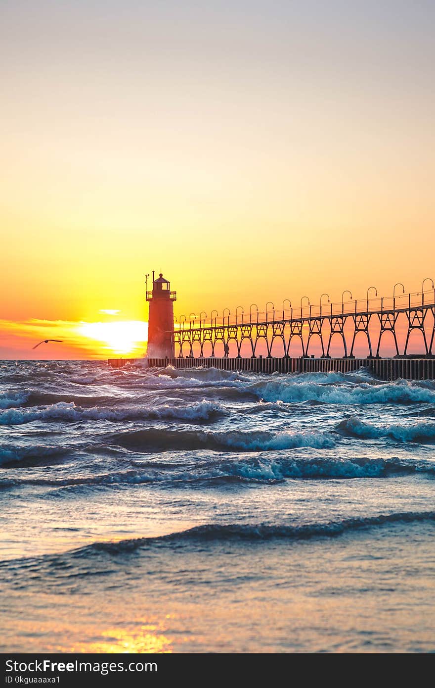 Scenic View of Ocean During Sunset