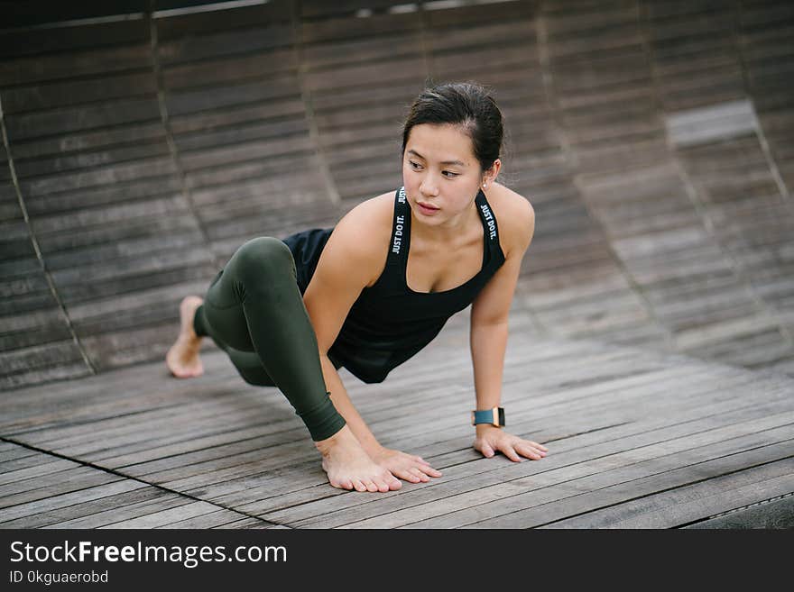 Woman Wearing Black Tank Top Crawiling