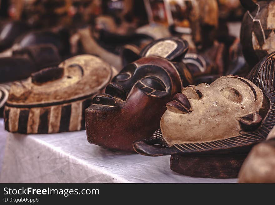 Selective Focus Photography of Mask Sculpture