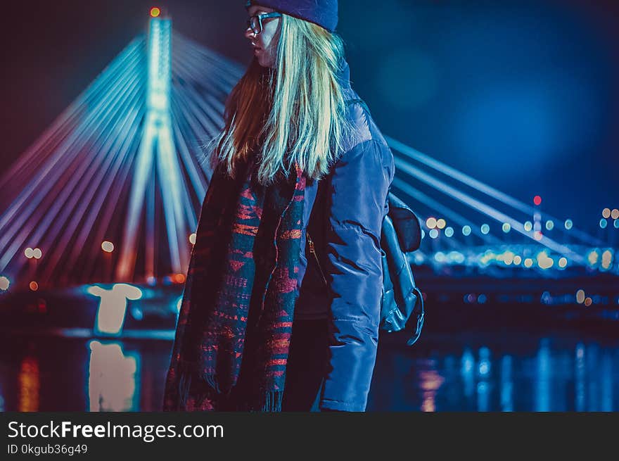 Woman Wearing Blue and Red Leather Jacket