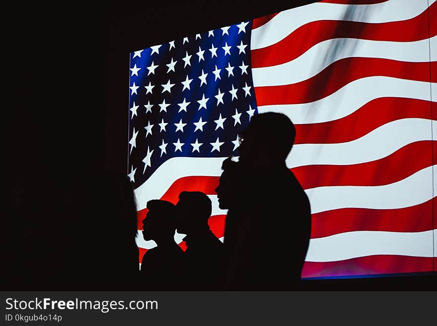 Silhouette of Four Person With Flag of United States Background