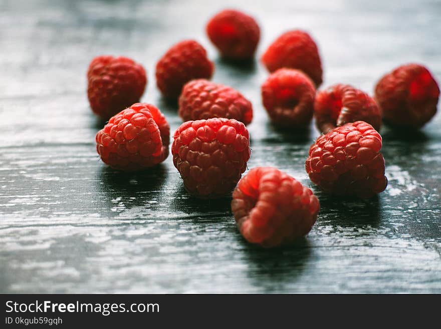 Raspberries on Black Wooden Board