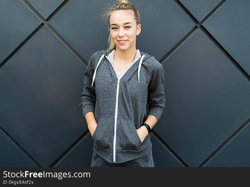 Portrait Of Young Beautiful Fitness Woman, Isolated On Black Background Outdoors In The City Space