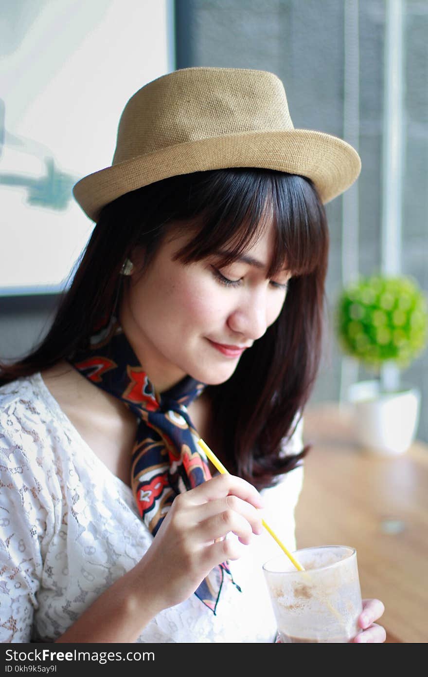 Close-Up Photography of a Woman Wearing Hat