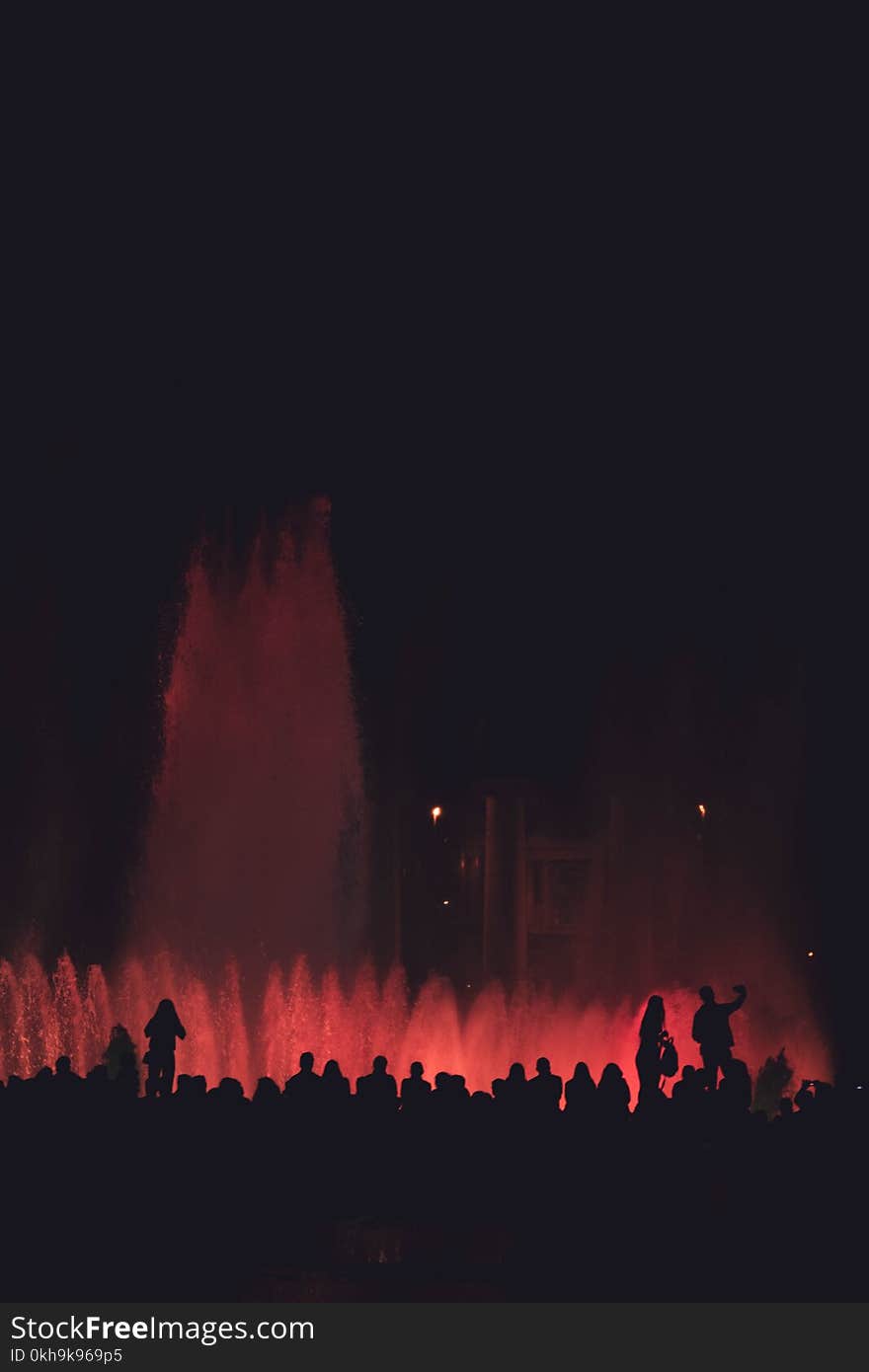 Silhouette Of People Near Fountain