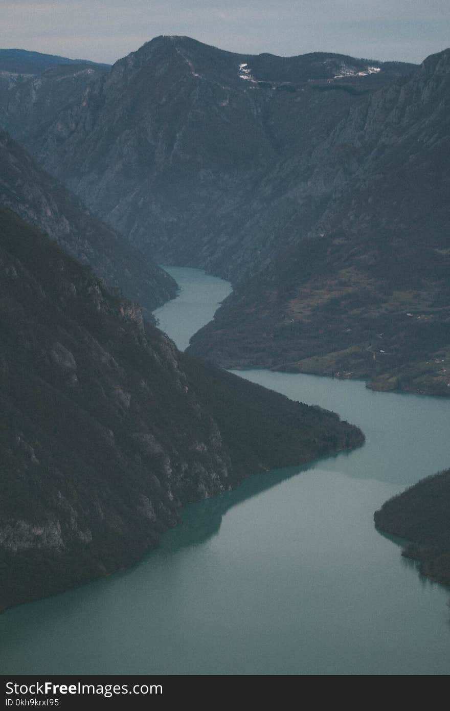 Photography of a River Between Mountains