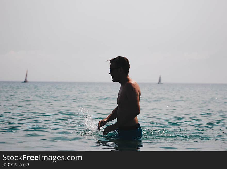 Photography of a Man in Ocean