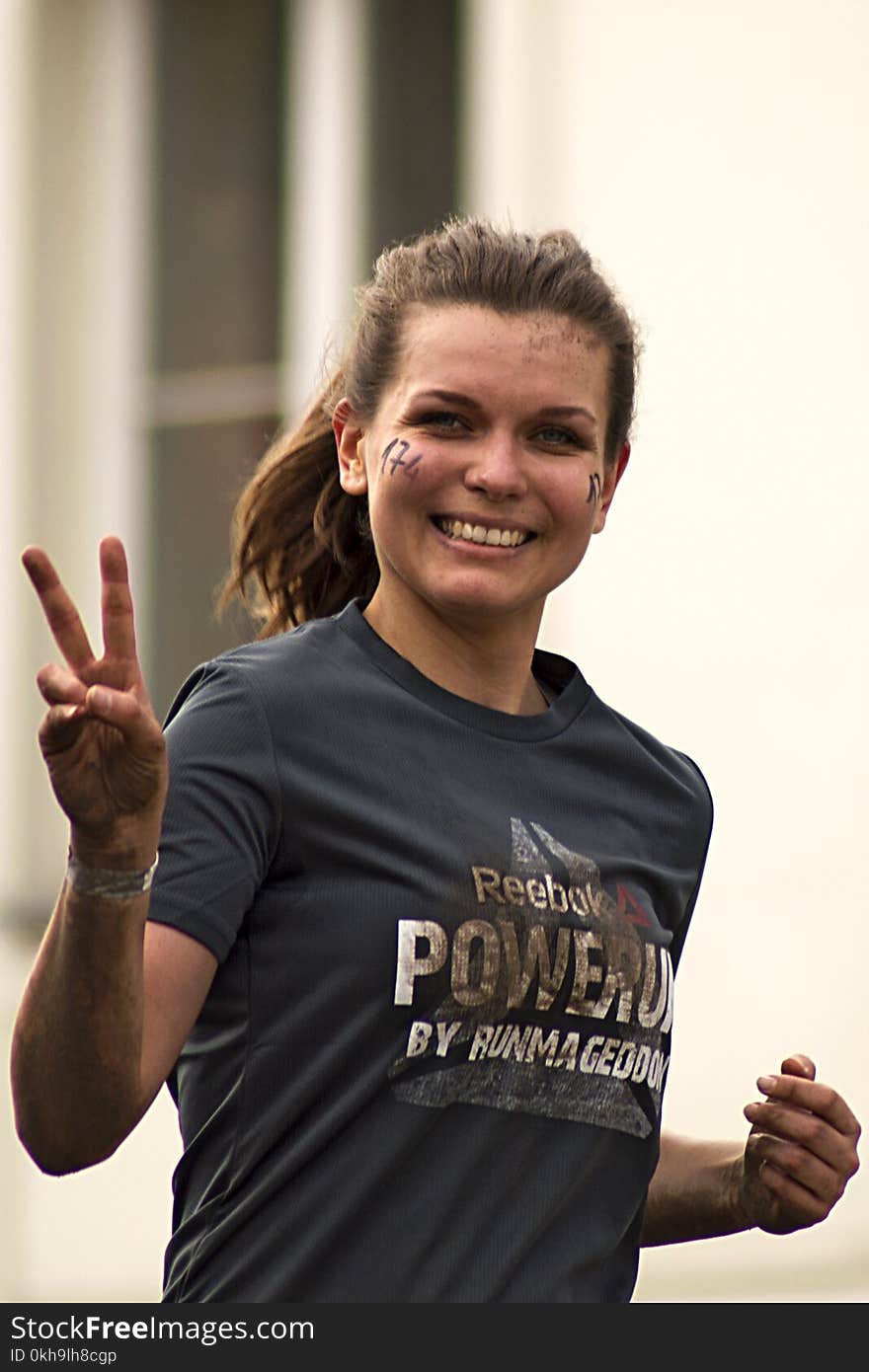 Woman Running Wearing Gray Shirt