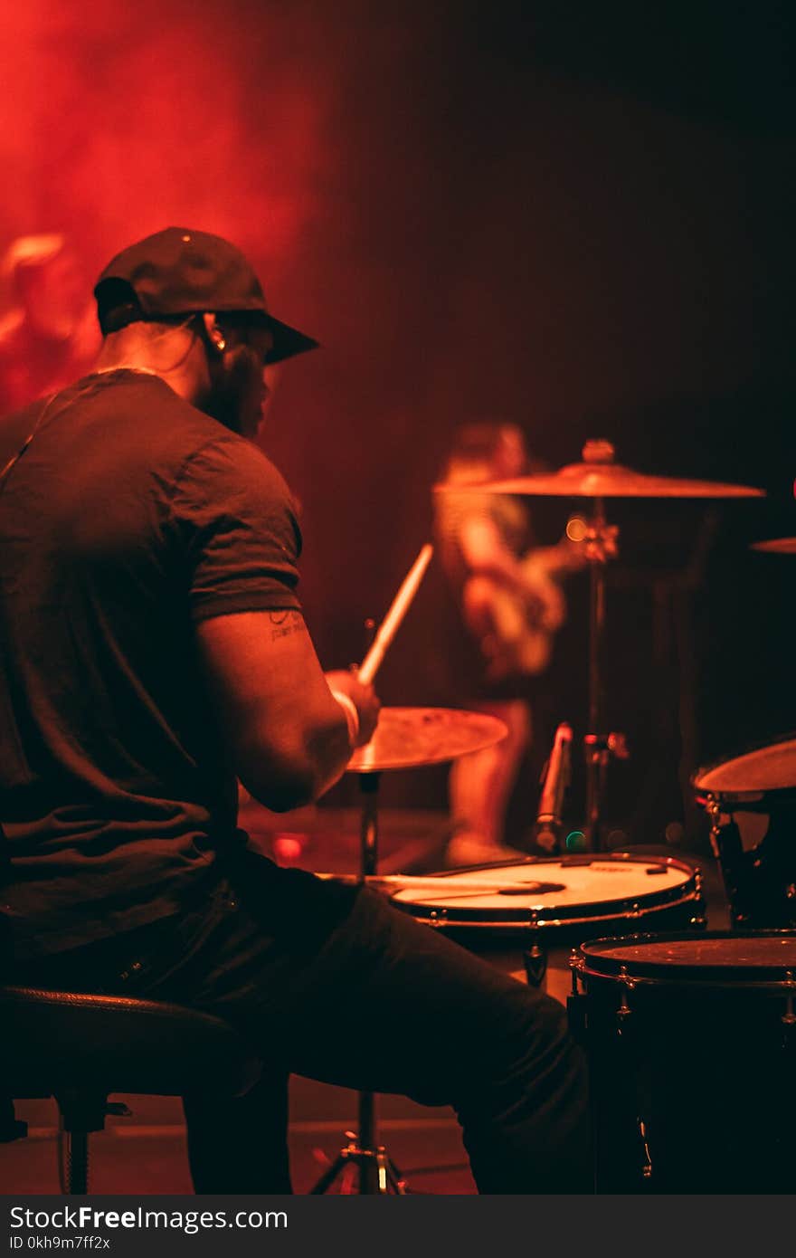 Man&#x27;s Wearing Black Shirt Playing Drum