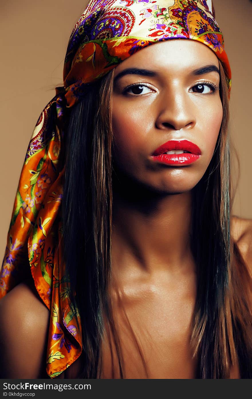 Beauty bright real african woman with creative make up, shawl on head like cubian closeup smiling