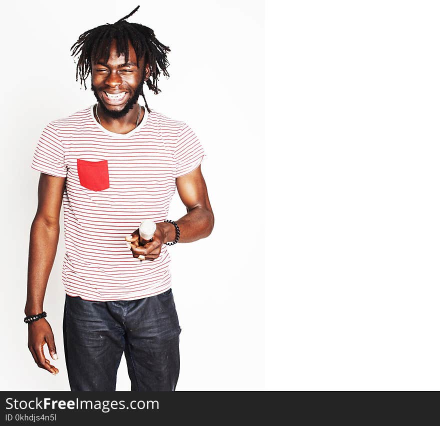 Young handsome african american boy singing emotional with microphone isolated on white background, in motion gesturing smiling, lifestyle people concept close up