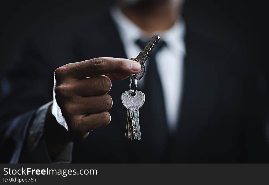 Asian Businessman Holding Keys