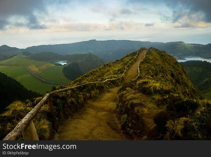 A path leads to a view above various volcano-shaped lakes at the São Miguel Island, in Azores. A path leads to a view above various volcano-shaped lakes at the São Miguel Island, in Azores.