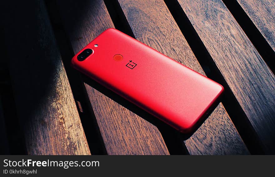 Close-Up Photography of Red Mobile Phone