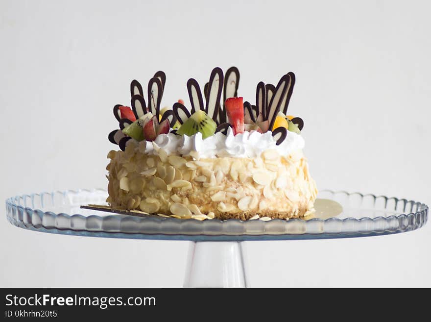 Photo of Brown and White Icing Covered Cake With Kiwi