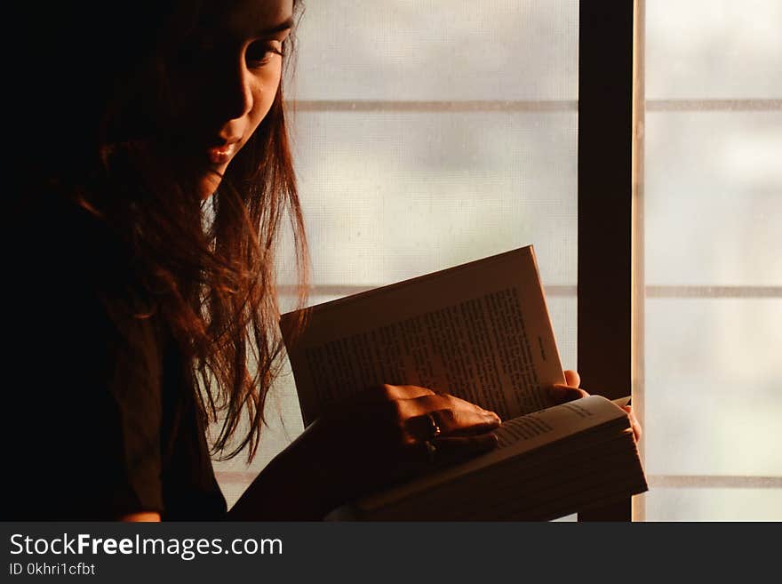 Close-Up Photography of a Woman Reading