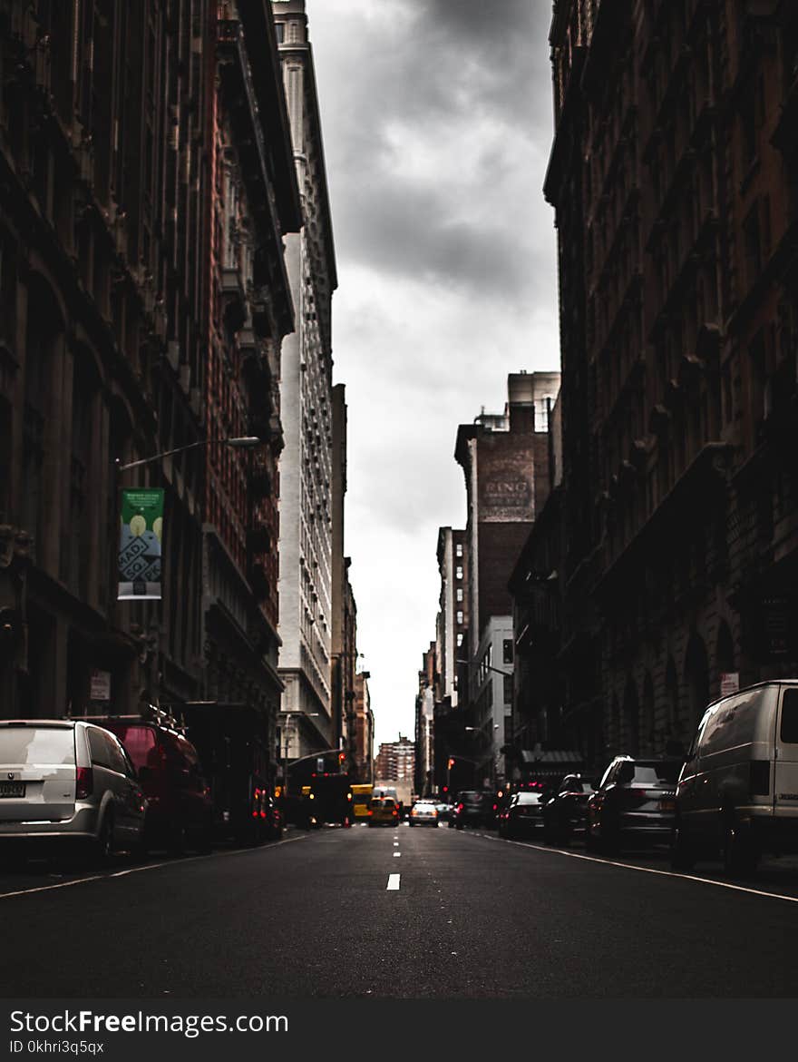 Photography of Roadway In the Middle of Buildings