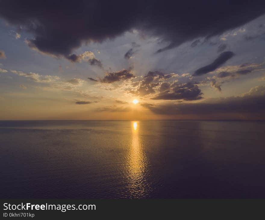 Scenic View of Ocean During Sunset