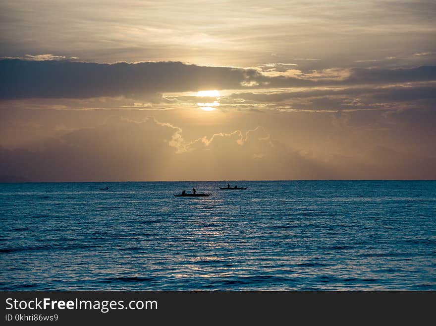 Scenic View of Ocean During Sunset