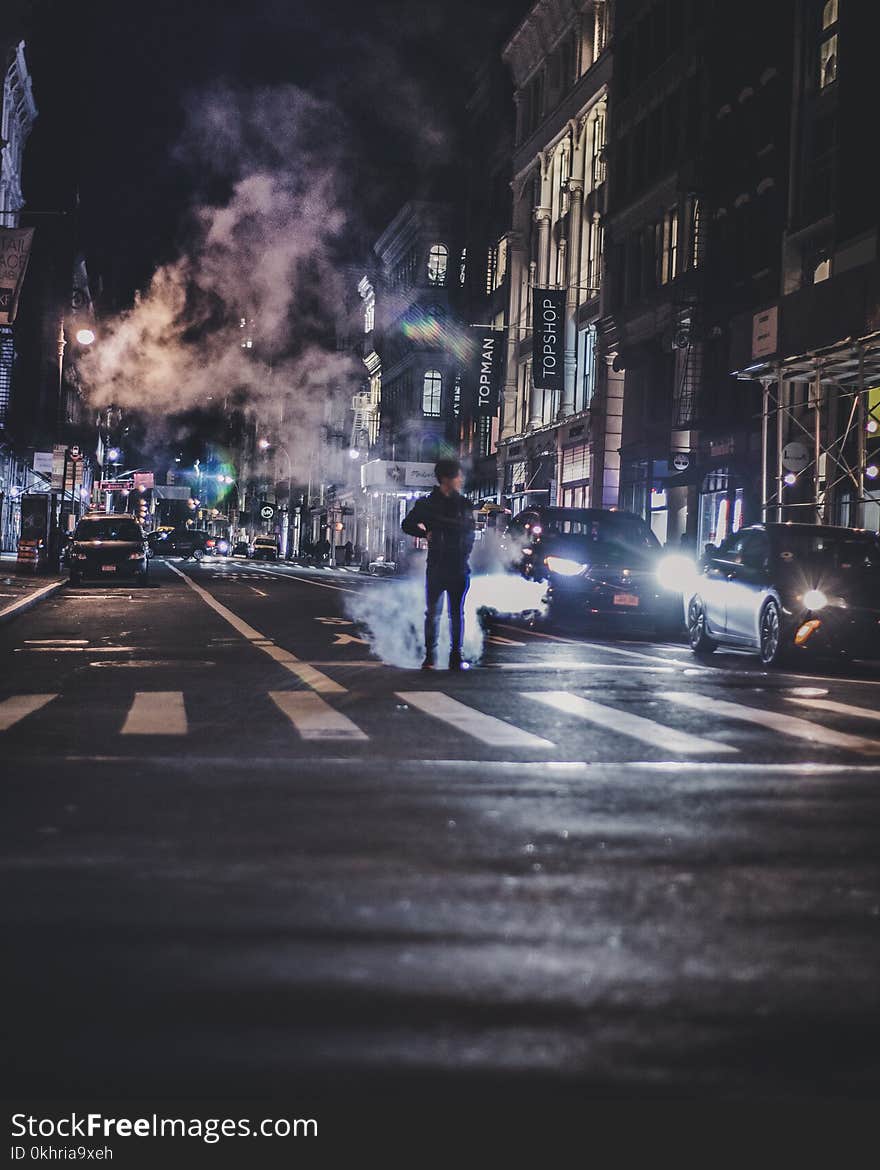 Photo of Man in the Middle of the Road