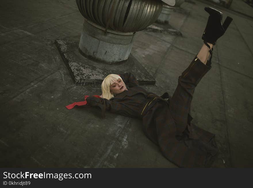 Photo of Woman Laying Down on Floor