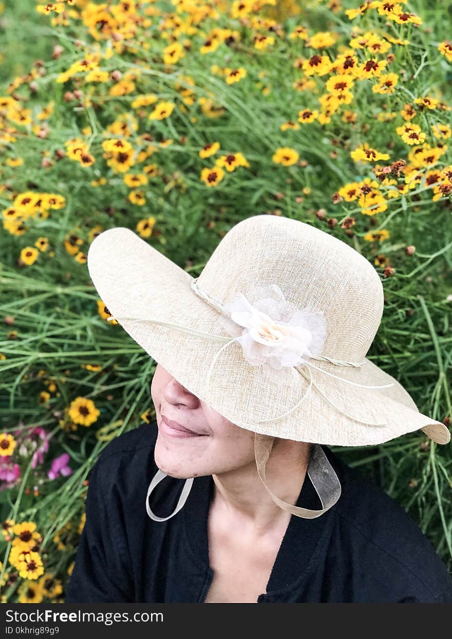 Close-Up Photography of a Woman Near Flowers