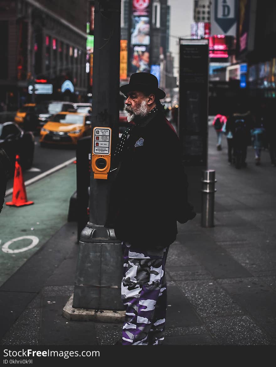 Photo of Man Standing in the Street