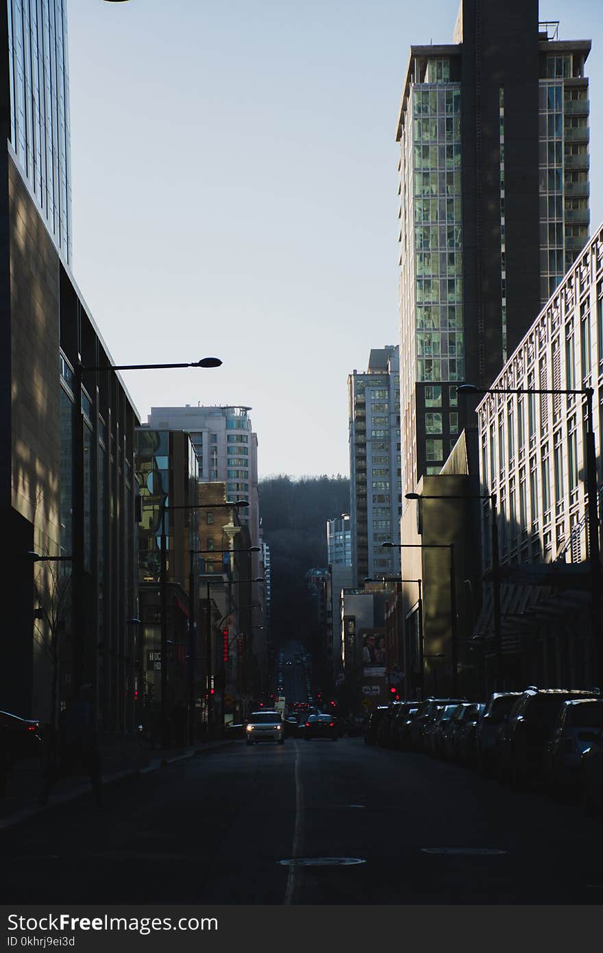 Photography of Roadway in Between Buildings