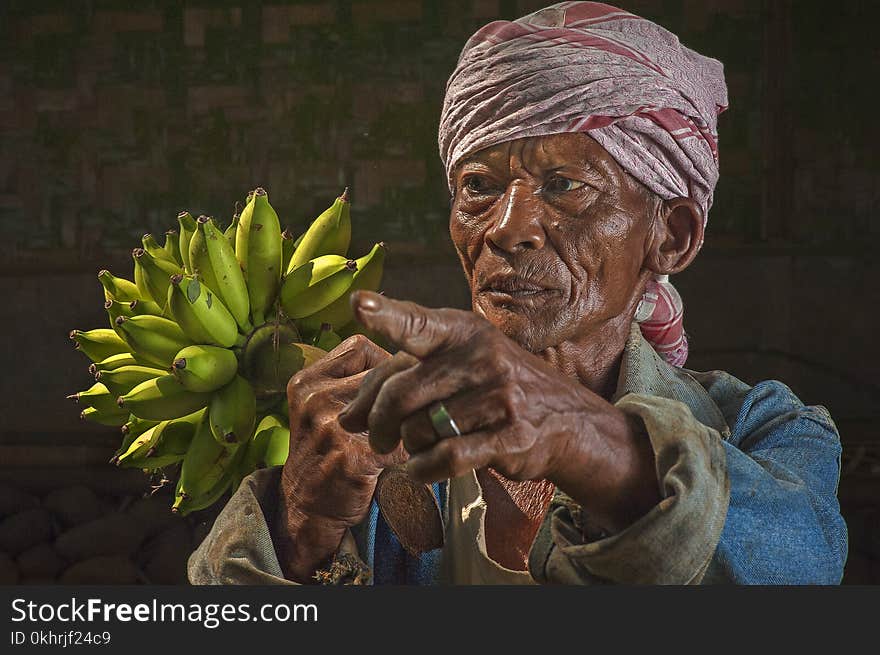 Woman Holding Bananas Figurine