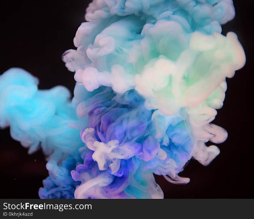 Photo of White, Purple, and Blue Smoke