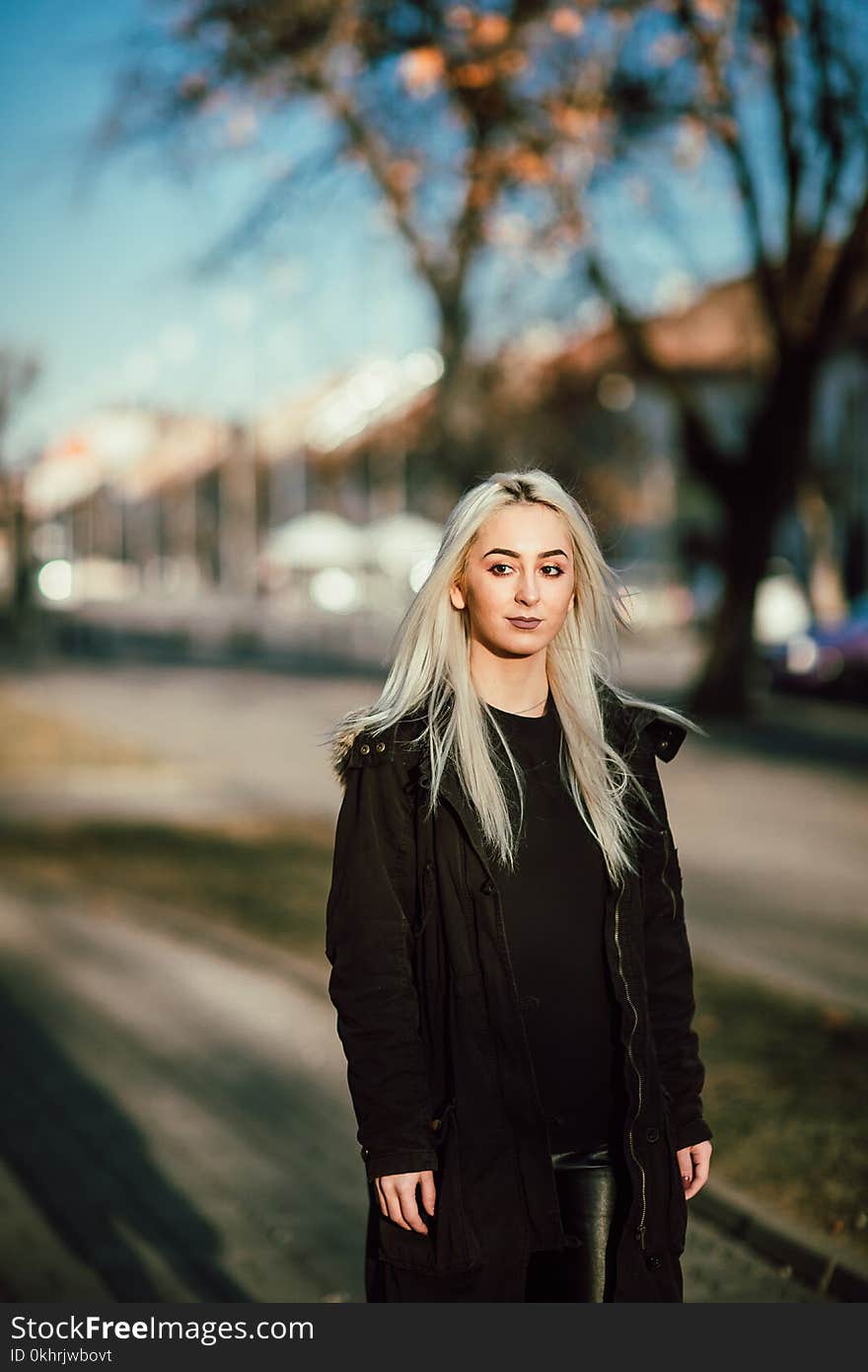 Woman Wearing Black Full-zip Coat Standing Near Green Tree