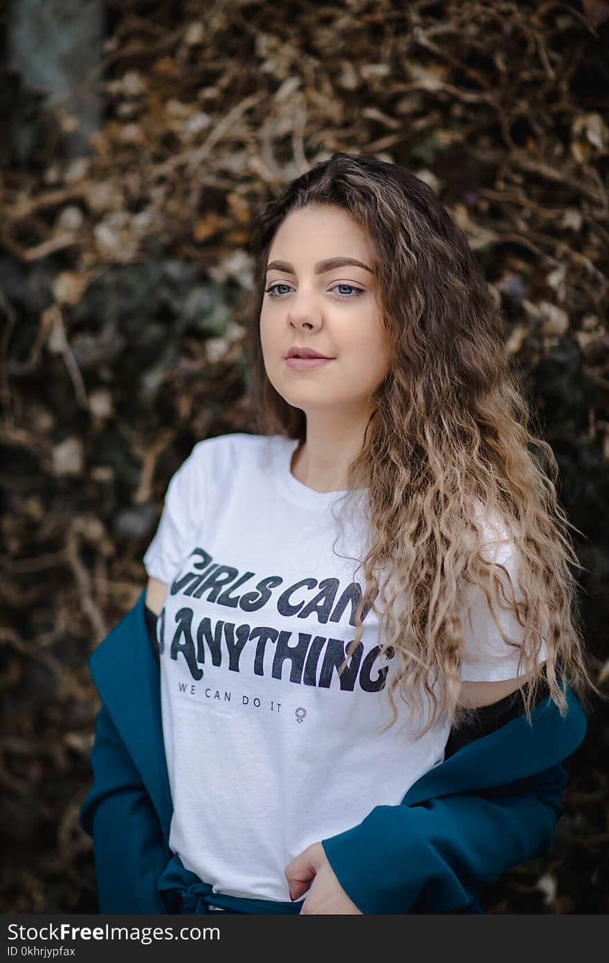 Shallow Focus Photography of Woman in White T-shirt and Blue Jacket