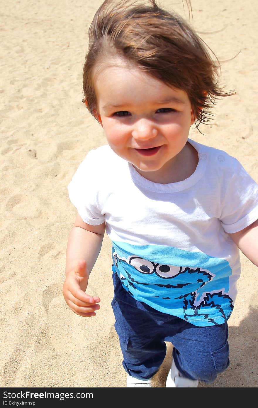 Portrait Of Old Cute Baby Enjoying His Time On The Beach, Platja Castell, Costa Brava, Girona, Catalonia, Spain