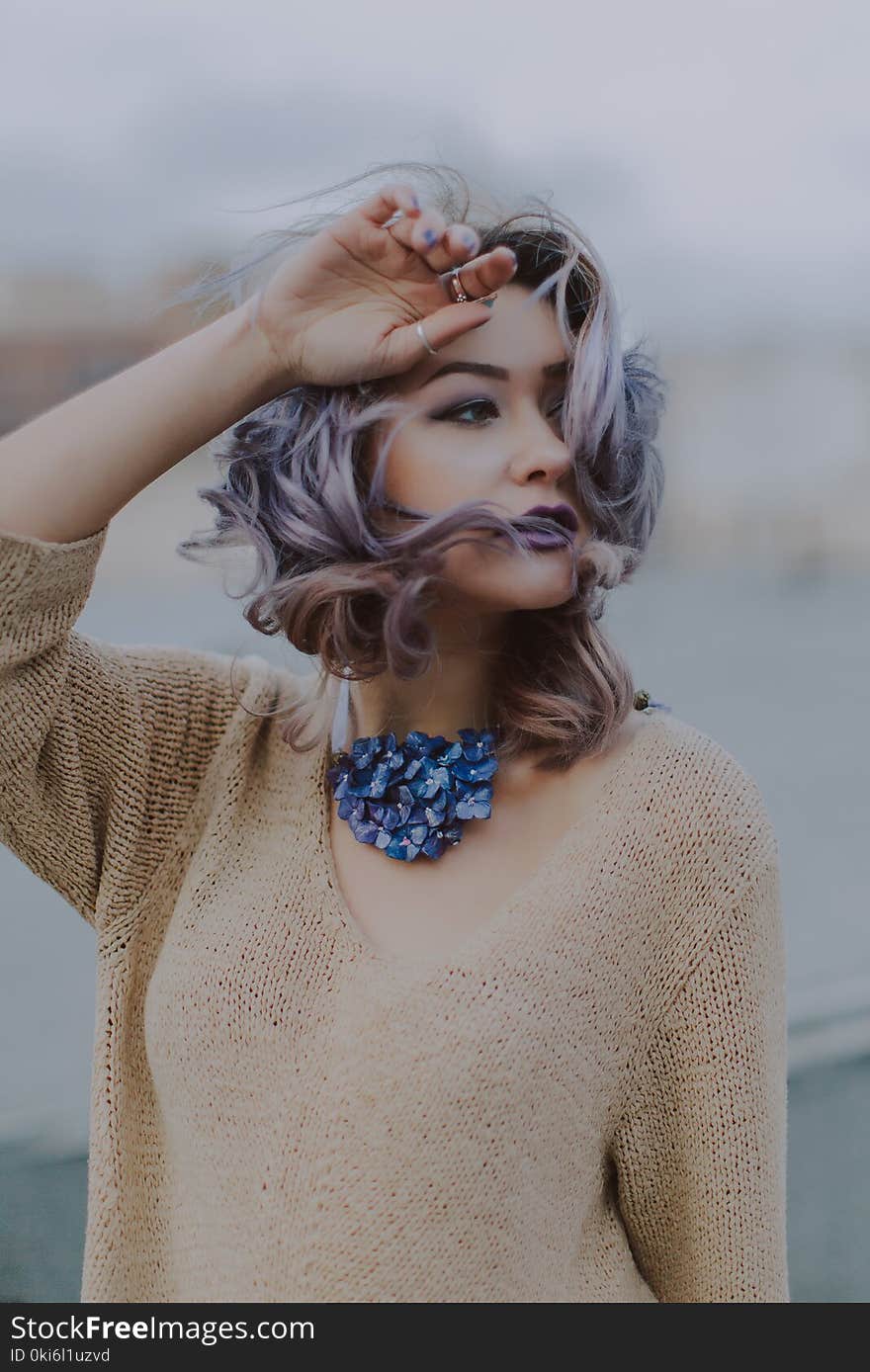 Woman Wearing Brown V-neck Knit Shirt