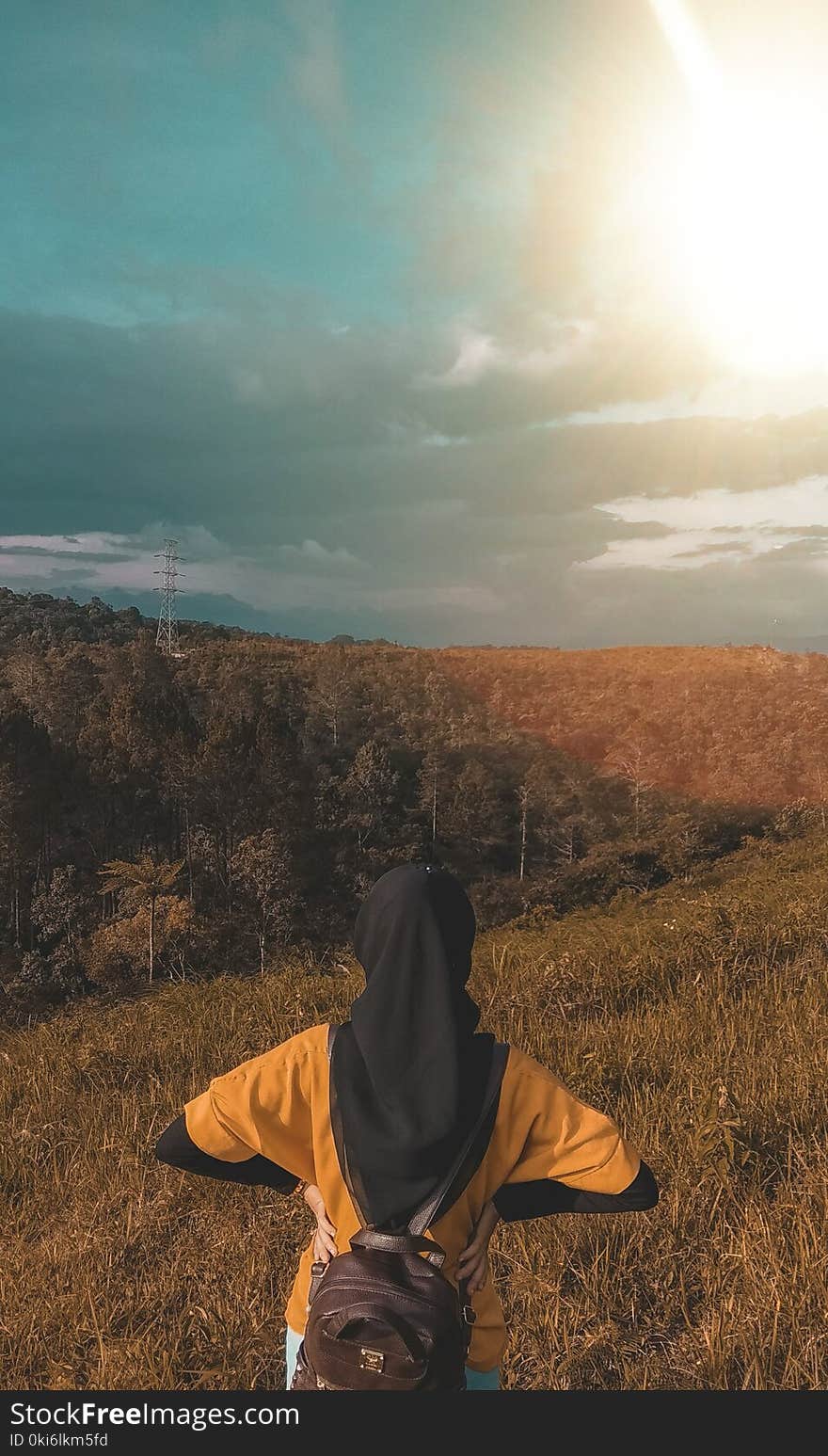 Woman Wearing Black Headdress on Top of Mountain