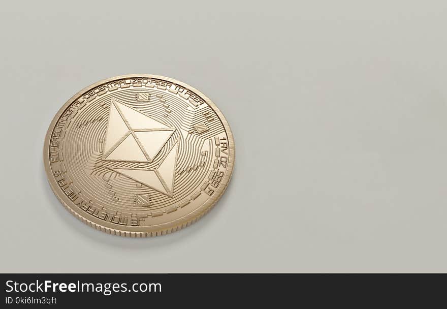 Round Gold-colored Ethereum Coin