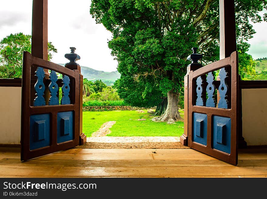 Opened Brown Wooden Gate