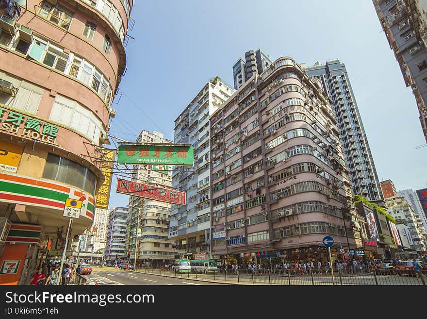 Group of People Near Road and Buildings