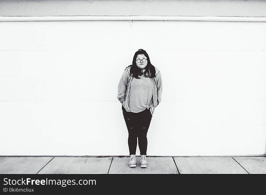 Woman Standing Beside Wall