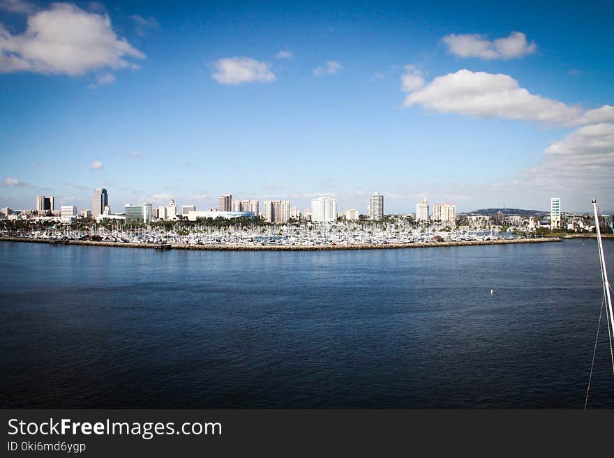 Body of Water With Buildings on Side