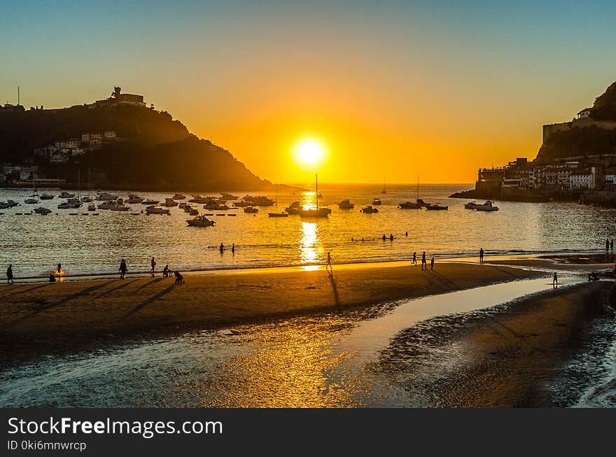 People Walking Beside Seashore