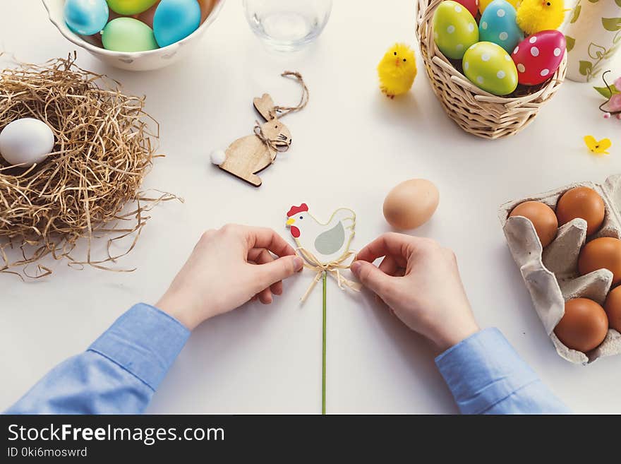 Person Tying Knot on Chicken Decor