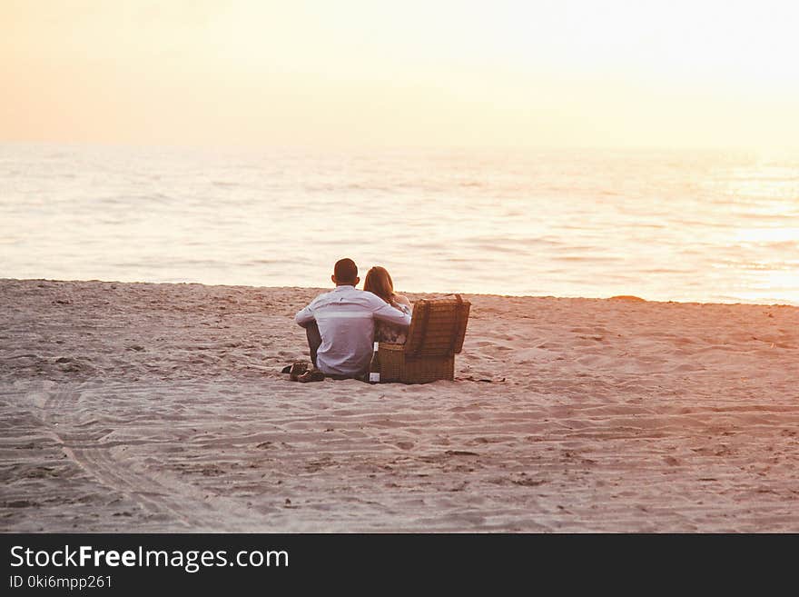 Couple at Beach Near Cooler