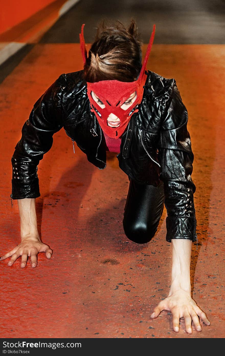 Person on Floor Wearing Black Latex Leather Jacket