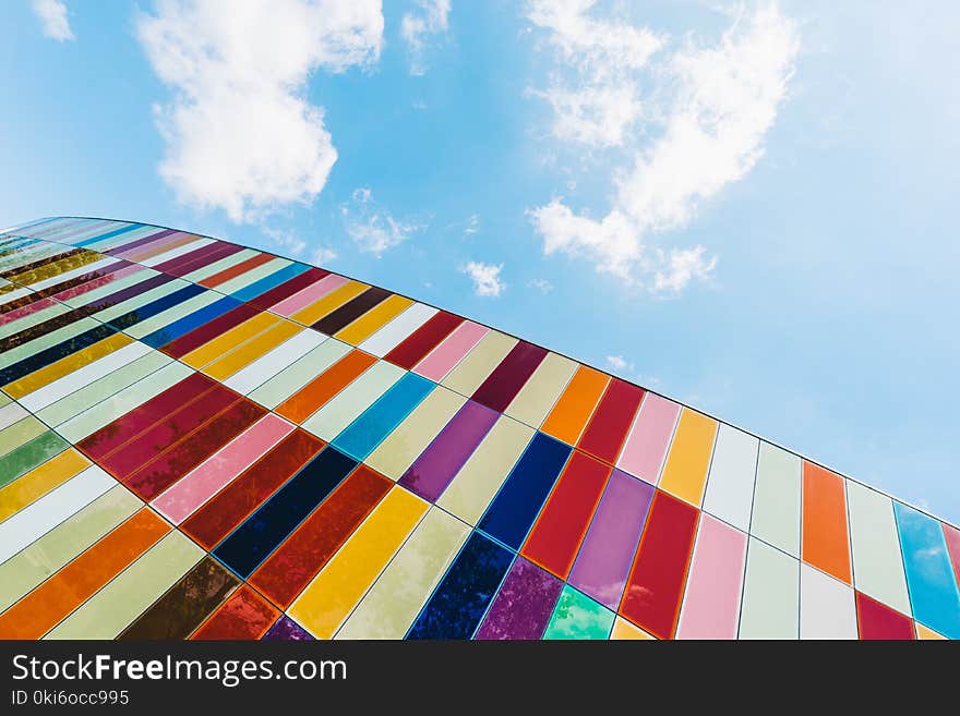 Low Angle of Colorful Glass Panels Under Blue Sky