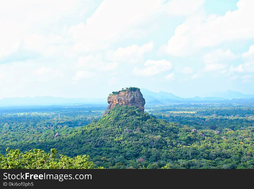 Photo Of Rock Formation Surrounded With Green Trees