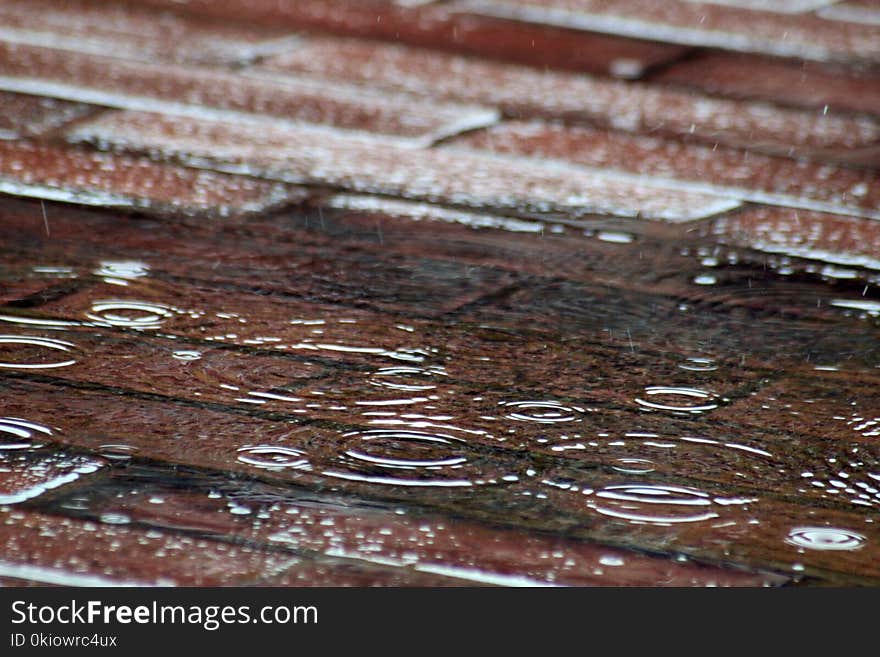 Raindrops On Red Brick Pavement