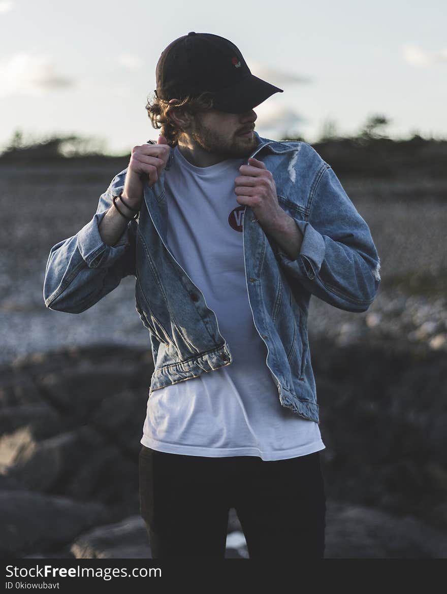 Man in Blue Denim Jacket, White Crew-neck Shirt and Black Pants